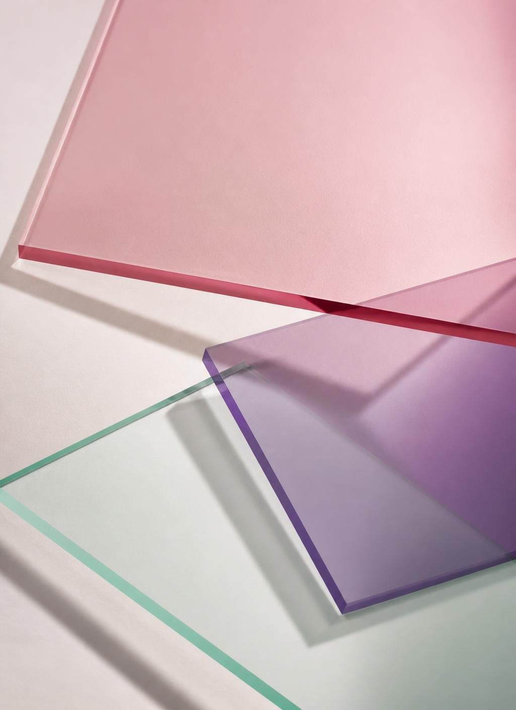 Overlapping translucent panels in blush, violet and mint tones